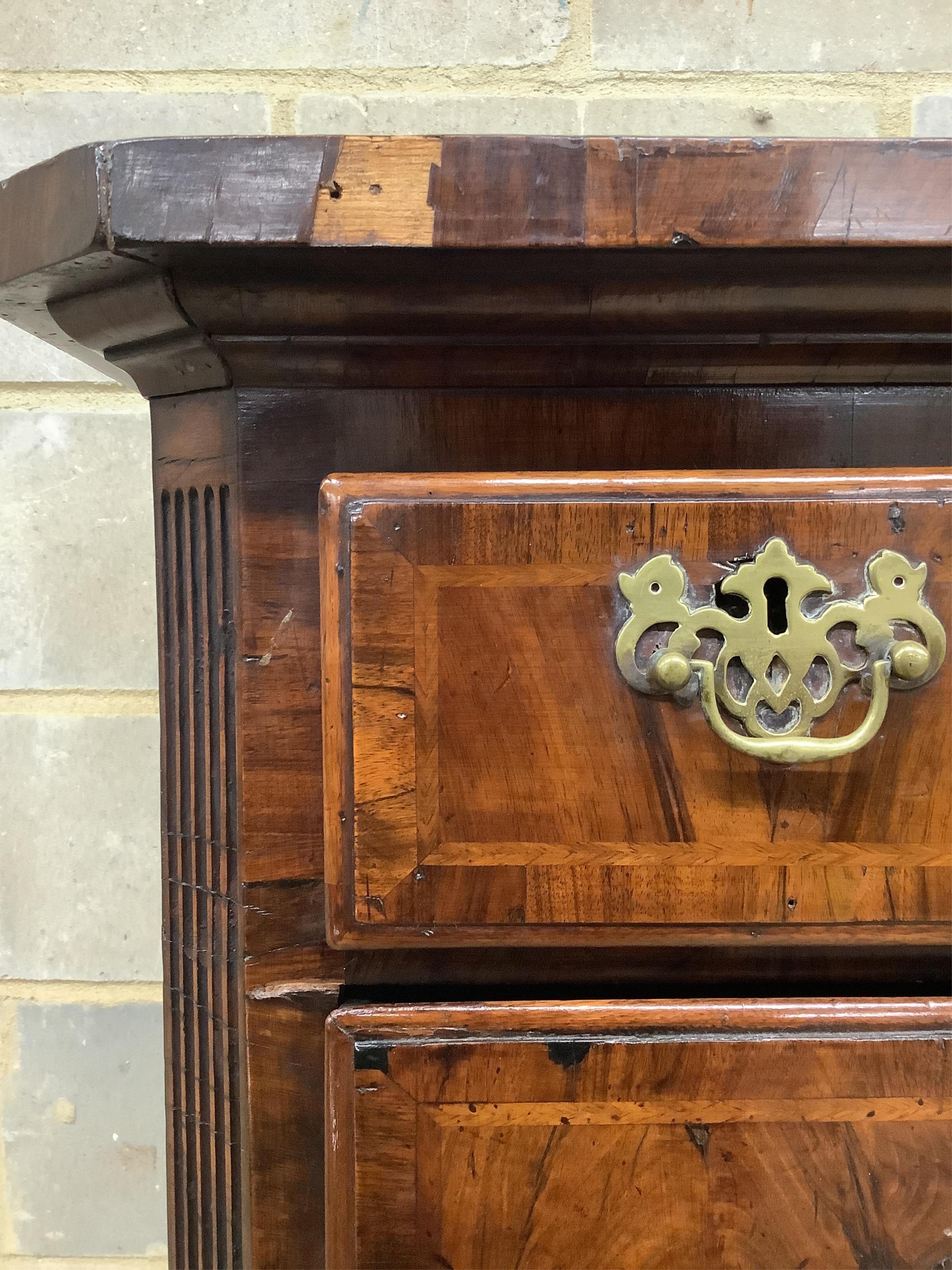 An 18th century walnut chest on later stand, width 106cm, depth 56cm, height 159cm. Condition - fair to good